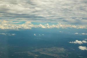 View above clouds and blue sky on airplane. photo