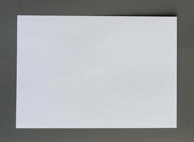 White crumpled paper on gray background horizonta photo