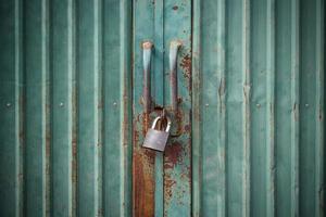 grunge green door lock with key photo