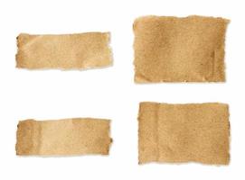 Torn brown paper sheet set on isolated white background photo