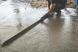 Mason building a screed coat cement photo