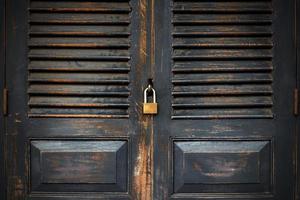 Close up black door with key lock photo