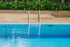 Swimming pool with stair at hotel. photo