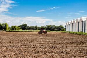 tractor working in field agriculture. photo