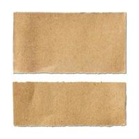 Torn brown paper sheet on white background photo