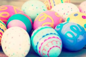 Easter eggs and paint on wooden with vintage tone photo