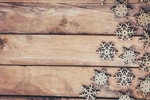 Snowflakes On Wood Background, Christmas Snow Flakes, Winter Decoration With Space. photo