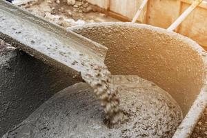 Pouring cement during for construction with with vintage tone. photo