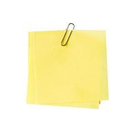 blank yellow note and clip on isolated white photo