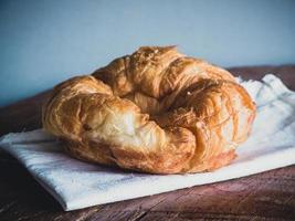 fresh croissants on wood gray background photo
