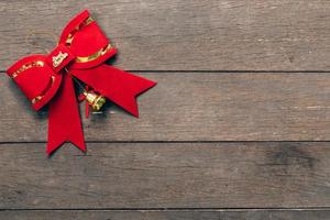 Red bow christmas on wood background with copyspace. photo