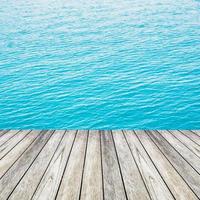 Wood, blue sea and sky background photo