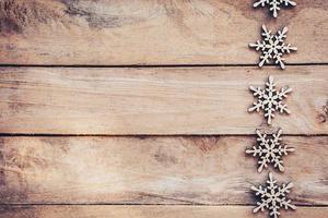 Snowflakes On Wood Background, Christmas Snow Flakes, Winter Decoration With Space. photo