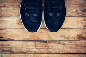 Black shoes casual and sneaker on wood background with space. photo