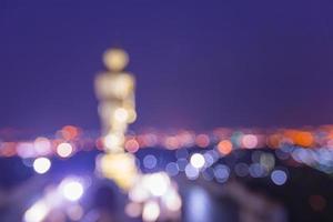 Blurred statue of buddha and city at Wat Phra That Kao Noi Temple Nan, THAILAND. photo