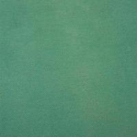 green fabric texture and background close up photo