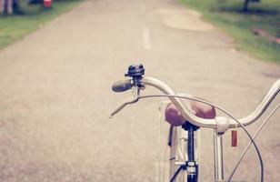 bell and brake vintage bike on road photo