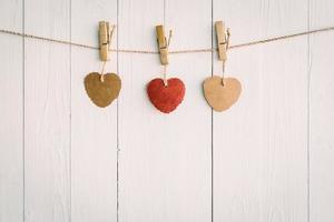 Heart on white wooden background with Vintage style. photo