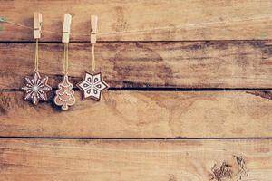Ornamental christmas decoration hanging on wooden for christmas background with space photo
