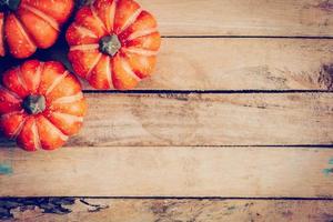 autumn background with pumpkin on wooden board with space, Vintage filter. photo
