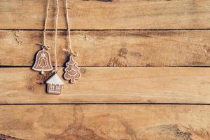 Christmas decoration hanging on wood background texture with copy space. photo