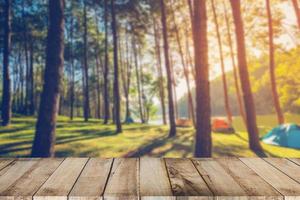 Abstract blurred pine tree and wood table with sunlight vintage photo