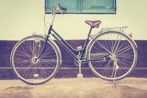 vintage bicycle with wall photo