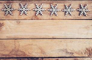 Christmas decoration with wood snowflake on table with copy space photo
