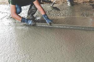 Mason building a screed coat cement photo