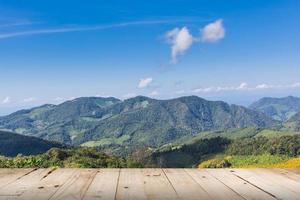 view mountain and blue sky with wood table photo