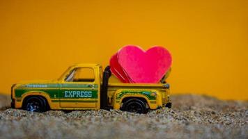 Minahasa, Indonesia December 2022, the toy cars transporting hearts photo