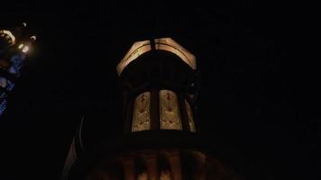 Beautiful palace in the dark night with the warm lighting and a huge tower video