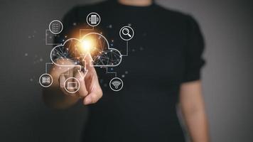 Businesswoman hand working with a Cloud Computing diagram on the new computer interface as concept photo