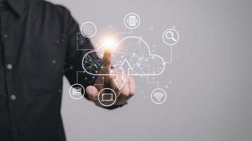 Businessman hand working with a Cloud Computing diagram on the new computer interface as concept photo