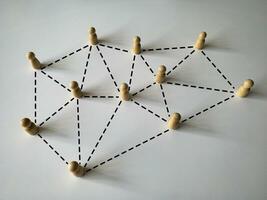 Wooden people figure networking concept. Online internet communication and networking concept photo