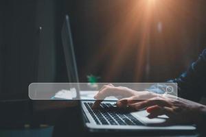 Search Engine Optimization SEO, data searching technology. business hands typing on laptop computer keyboard to search the information via internet web browser. Browsing social networking interface. photo