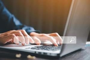 Search Engine Optimization SEO, data searching technology. business hands typing on laptop computer keyboard to search the information via internet web browser. Browsing social networking interface. photo