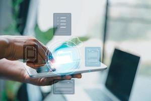 Concept of online document management technology. Businesspeople manage corporate databases through cloud, cyberspace technology and large, paperless archives of important, file and online storage. photo