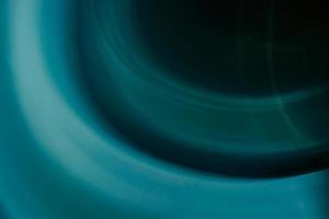 Abstract background of circles and waves in blue, turquoise and dark colors. photo