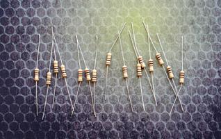 Resistors are electronic devices that control the amount of current and voltage between two points in a circuit. Soft and selective focus. photo