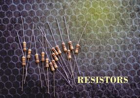 Resistors are electronic devices that control the amount of current and voltage between two points in a circuit. Soft and selective focus. photo