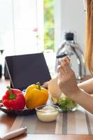 young woman preparing bell Pepper as a breakfast ingredient and ready for healthy cooking and on the table there are vegetables that are healthy organic ingredients. healthy food preparation ideas photo