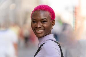 Modern and young woman smiling to the camera photo