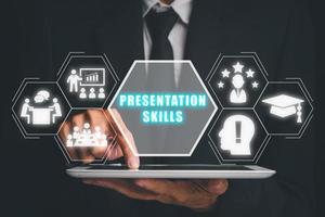 Presentation skills concept, Person hand using digital tablet with presentation skills icon on virtual screen. photo