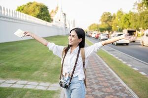 Beautiful tourist woman on vacation sightseeing and exploring Bangkok city, Thailand, Holidays and traveling concept photo