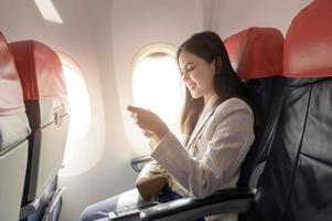 A young woman is traveling on airplane photo