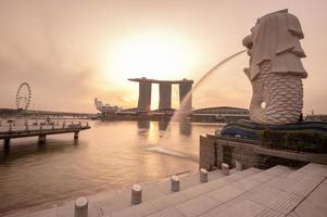 SINGAPORE - 27.12.2565 Merlion fountain in front of the Marina Bay Sands hotel in the morning sunshine. Merlion is famous place as a symbol of Singapore photo