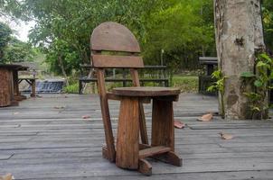 Old wooden chair in the park photo