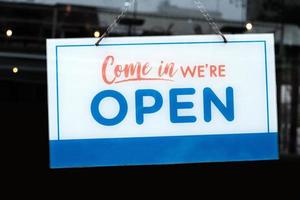 Open Sign in front of a Cafe and Restaurant. photo