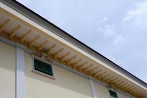 Vintage Thai Tradition Window and Roof with White Cloud and Blue Sky. photo